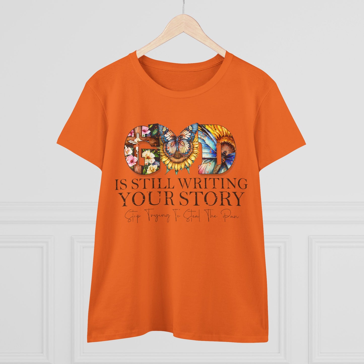 Orange t-shirt with motivational quote and colorful design on a white background