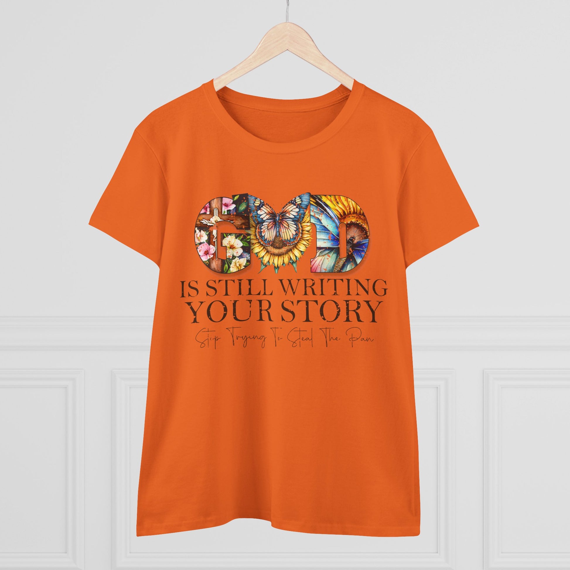 Orange t-shirt with motivational quote and colorful design on a white background